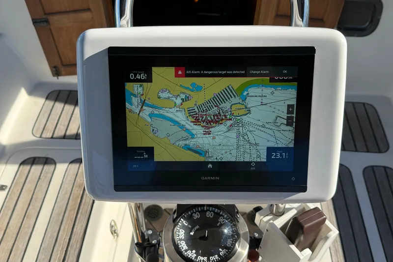 Slide: The Image of Garmin navigation display on 1985 Passport 40 sailboat, showing nautical chart and compass. - 14