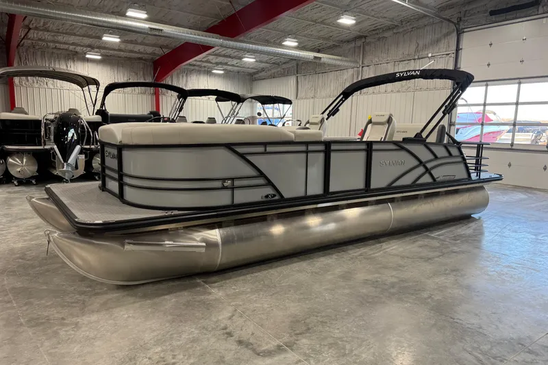 The Image of 2026 Sylvan Mirage X X5 pontoon boat in showroom, featuring sleek design and modern amenities. - 1