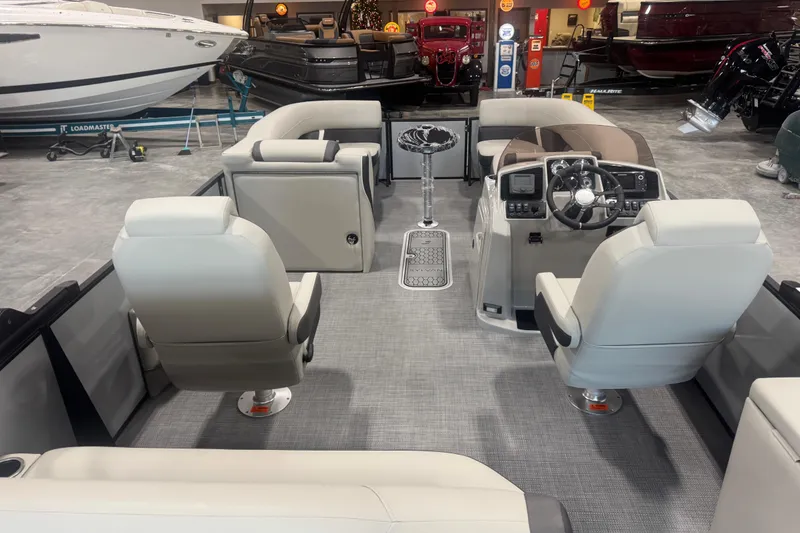 Slide: The Image of Interior of 2026 Sylvan Mirage X X5 pontoon boat with modern seating and controls. - 13
