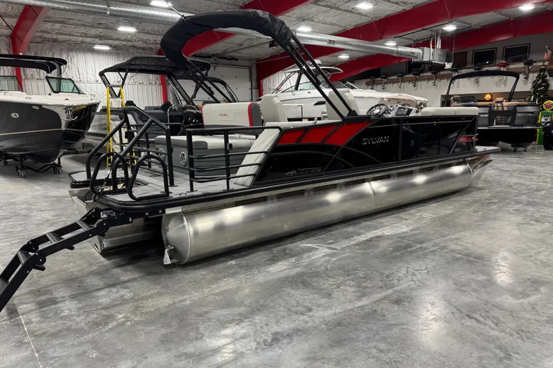 Slide: The Image of 2026 Sylvan X 5 pontoon boat in showroom, featuring sleek design and modern amenities. - 3