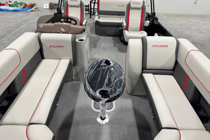 Slide: The Image of 2026 Sylvan X 5 boat interior with stylish seating and a sleek black table. - 7