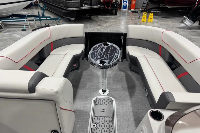 Slide: The Image of Luxurious interior of 2026 Sylvan X 5 boat with elegant seating and marble table. - 8