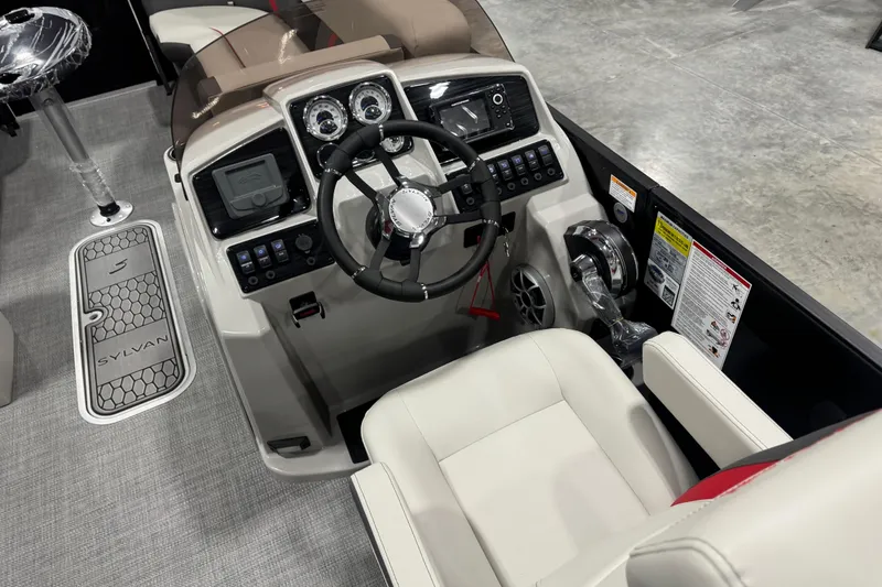 Slide: The Image of 2026 Sylvan X 5 boat cockpit with modern steering and control panel. - 9