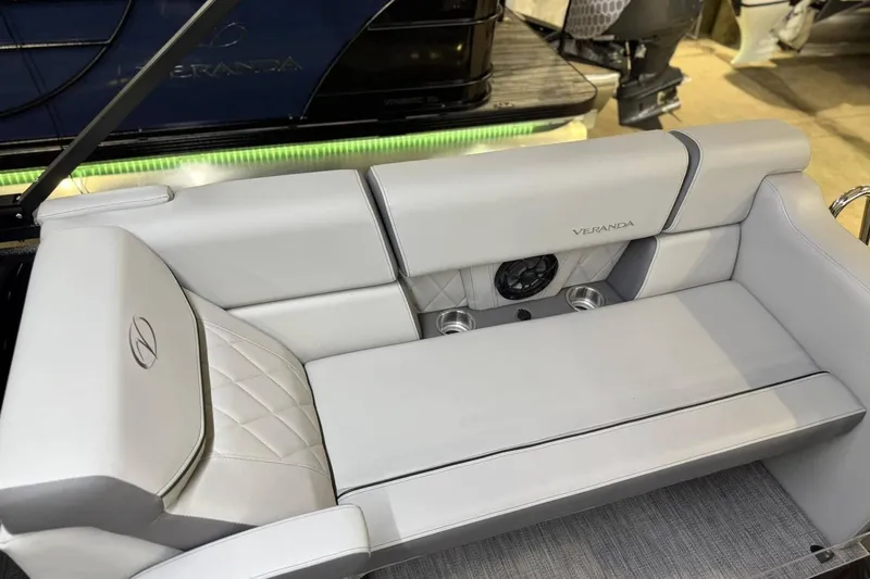 Slide: The Image of Luxurious seating in the 2025 Veranda VX 22 RC boat, featuring elegant upholstery and cup holders. - 5