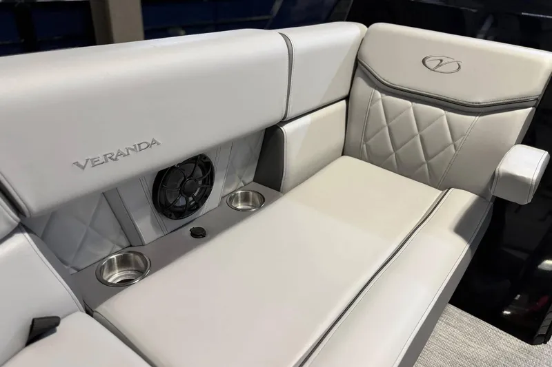 Slide: The Image of Luxurious seating on 2025 Veranda VX 22 RC boat with cup holders and speaker. - 7