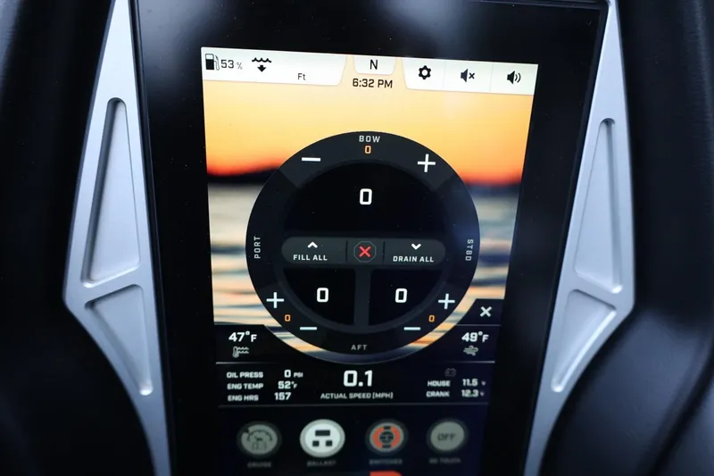 Slide: The Image of 2022 Tigé 24RZX touchscreen display showing boat controls and sunset background. - 25