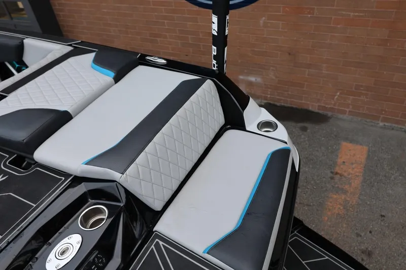 Slide: The Image of 2022 Tigé 24RZX boat interior with stylish seating and cup holder. - 3