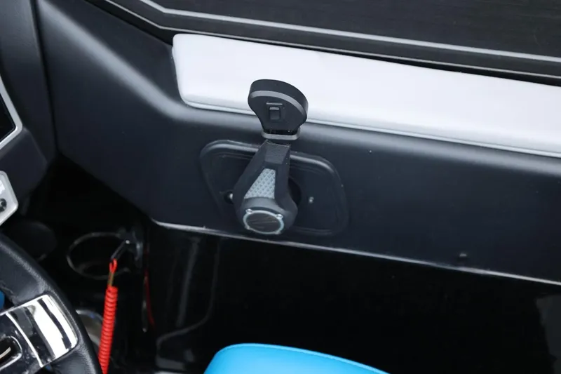 Slide: The Image of Interior detail of 2022 Tigé 24RZX boat, featuring a control lever and sleek design. - 30