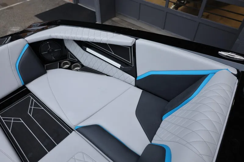 Slide: The Image of Luxurious interior of 2022 Tigé 24RZX boat with stylish seating and cup holders. - 34