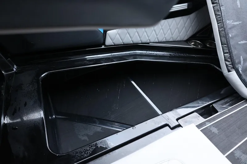 Slide: The Image of 2022 Tigé 24RZX boat storage compartment with sleek interior design. - 37