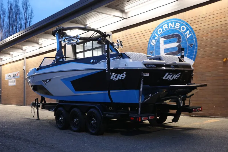 Slide: The Image of 2022 Tigé 24RZX boat on trailer outside Bjornson building. - 47