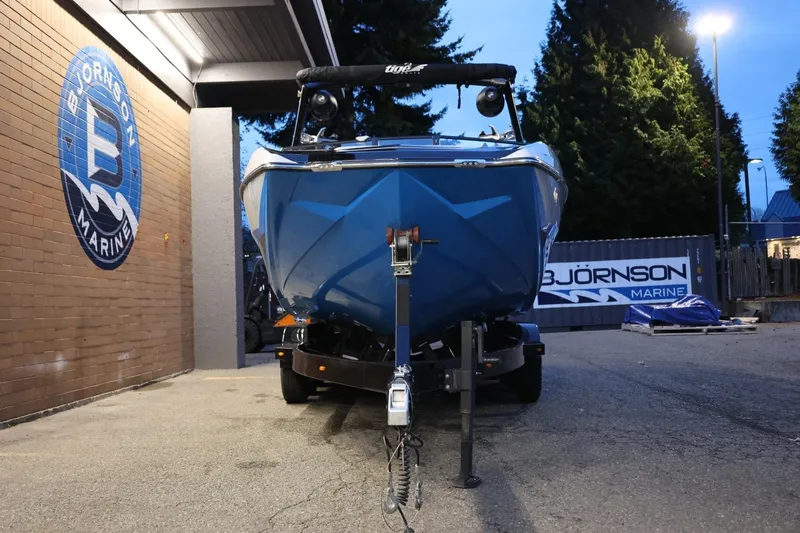 Slide: The Image of 2022 Tigé 24RZX boat on trailer at Bjornson Marine dealership. - 55