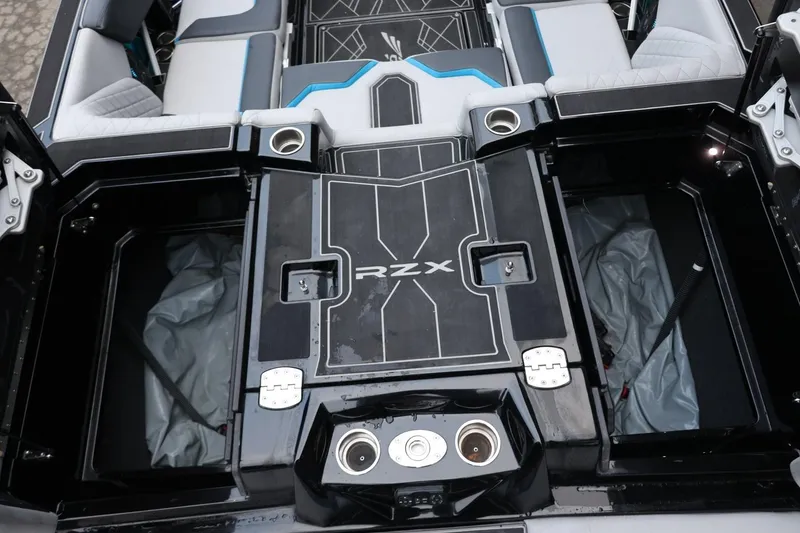 Slide: The Image of 2022 Tigé 24RZX boat interior with seating and storage compartments. - 6