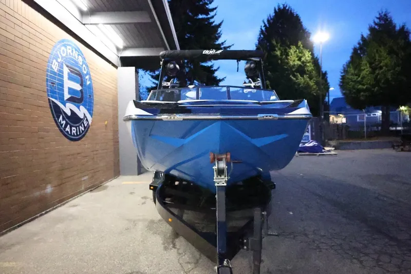 Slide: The Image of 2022 Tigé 24RZX boat on trailer at Bjornson Marine dealership. - 65