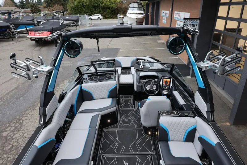 Slide: The Image of 2022 Tigé 24RZX boat interior with modern seating and advanced dashboard features. - 7