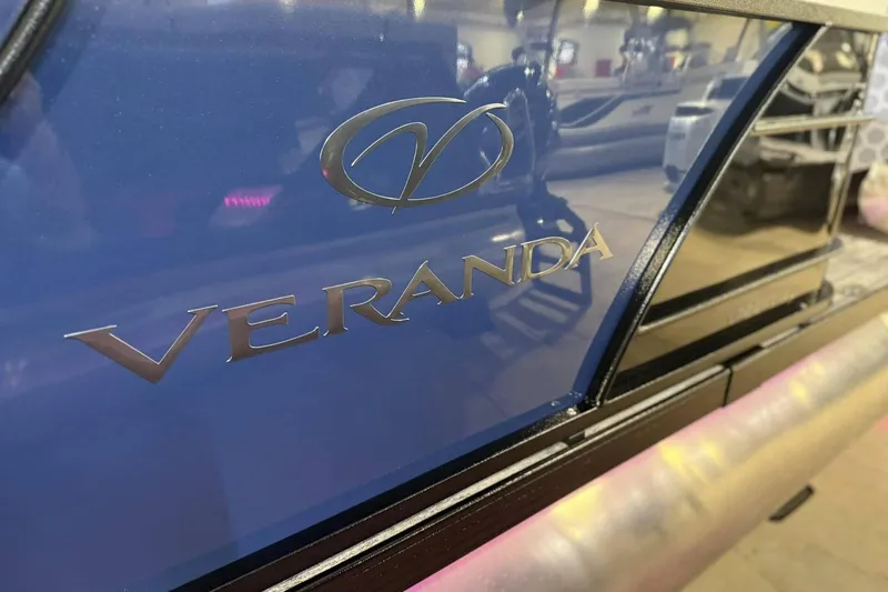 Slide: The Image of 2025 Veranda Relax VR 22 RC boat logo on sleek blue surface. - 4