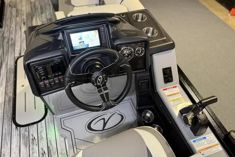 Slide: The Image of 2025 Veranda Relax VR 22 RC boat dashboard with steering wheel and control panel. - 9