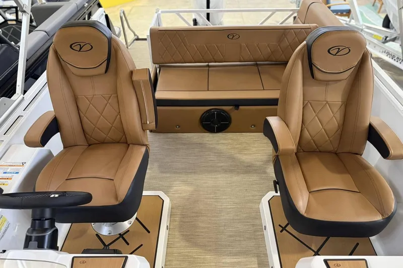Slide: The Image of 2025 Veranda VX 25 DCVL boat interior with luxurious tan leather seating. - 8