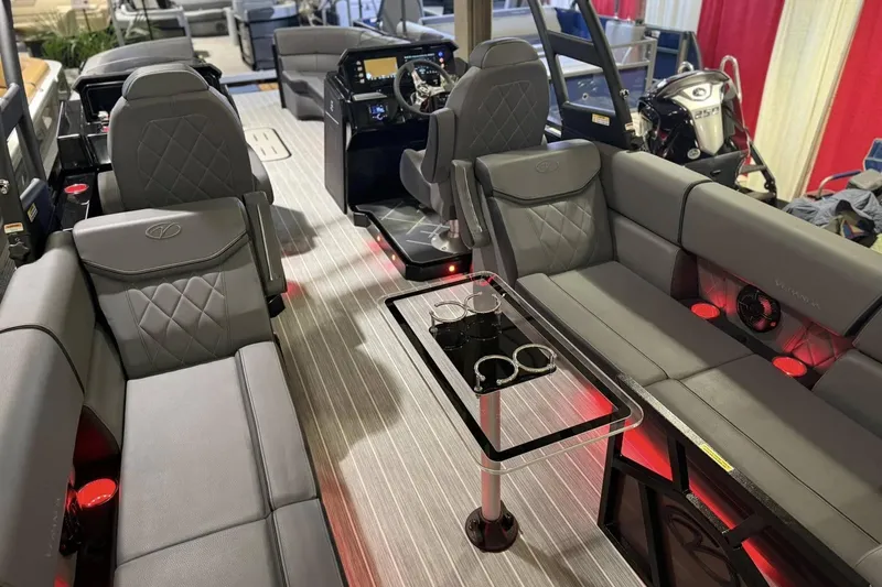Slide: The Image of Luxurious interior of 2025 Veranda VX 27 DCRC pontoon boat with modern seating and ambient lighting. - 2