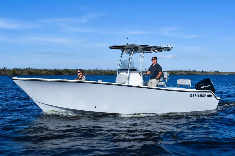 Slide: The Image of Manufacturer Provided Image: 2025 Defiance Catalina 240 boat cruising on open water under clear blue skies. - 13