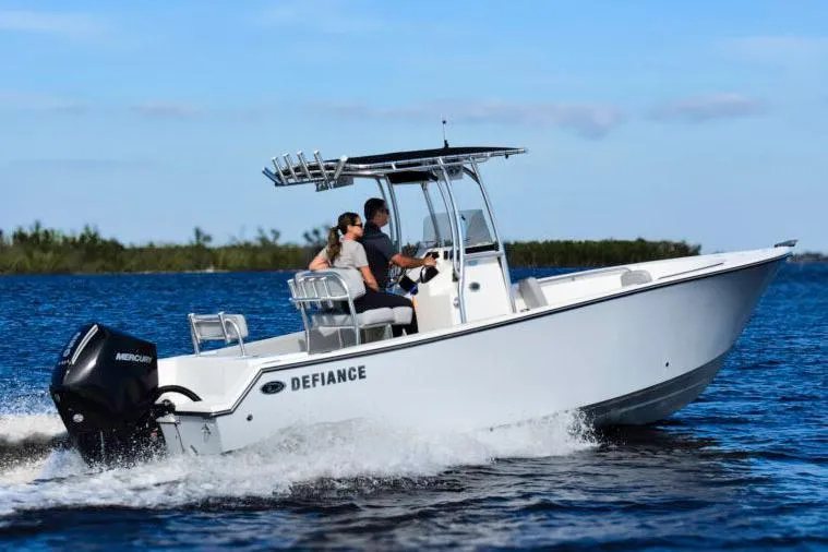 Slide: The Image of Manufacturer Provided Image: 2025 Defiance Catalina 240 boat cruising on open water under clear blue skies. - 15