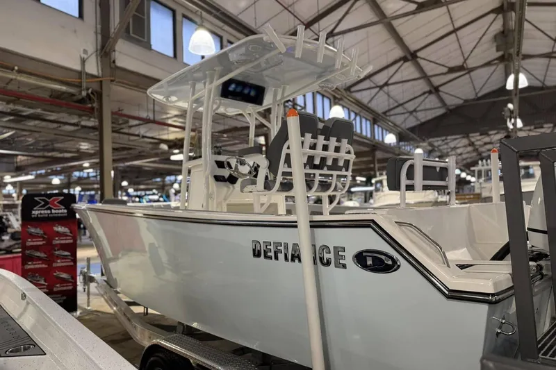 Slide: The Image of 2025 Defiance Catalina 240 boat displayed in an indoor showroom. - 3