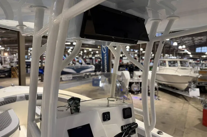 Slide: The Image of Interior view of 2025 Defiance Catalina 240 boat at a showroom display. - 4