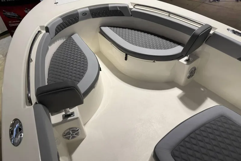 Slide: The Image of 2025 Defiance Catalina 240 boat interior with gray cushioned seating and modern design. - 5