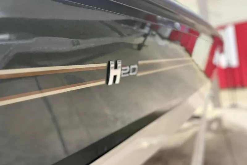 Slide: The Image of 2025 Xpress H20B Bay boat side view with logo and sleek design. - 10