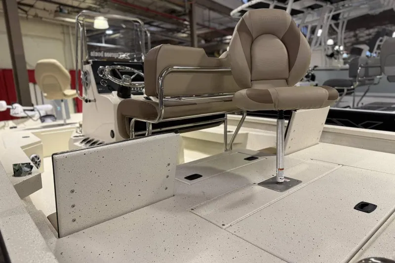 Slide: The Image of 2025 Xpress H20B Bay boat interior with beige seating and modern console. - 5