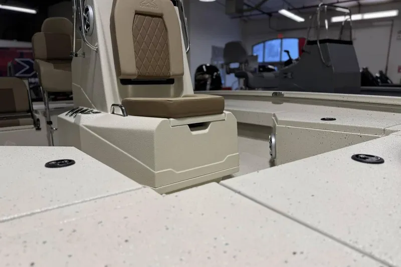 Slide: The Image of 2025 Xpress H20B Bay boat interior with beige seating and modern design. - 6