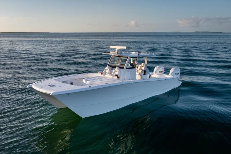 Slide: The Image of 2026 Freeman 35 boat on calm ocean waters at sunset. - 10