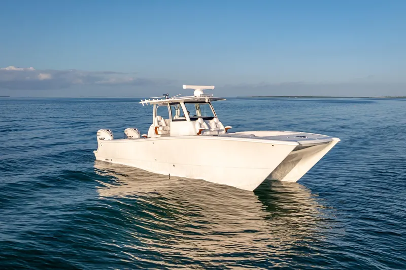 Slide: The Image of 2026 Freeman 35 boat on calm ocean waters under clear blue sky. - 11