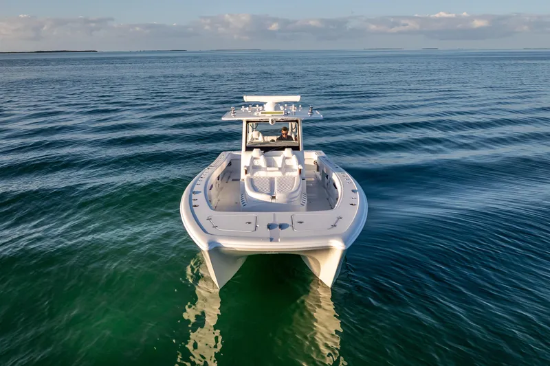 Slide: The Image of 2026 Freeman 35 boat cruising on calm ocean waters under a clear sky. - 12