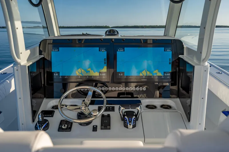 Slide: The Image of Helm of 2026 Freeman 35 boat with dual navigation screens and modern controls. - 17