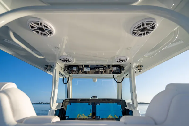 Slide: The Image of Interior view of 2026 Freeman 35 boat cockpit with navigation screens and speakers. - 21