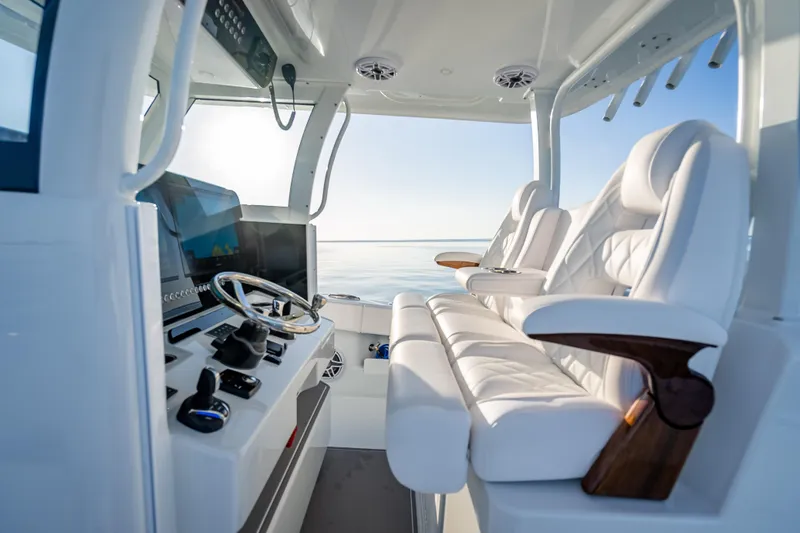 Slide: The Image of Luxurious interior of 2026 Freeman 35 boat with plush seating and modern controls. - 23