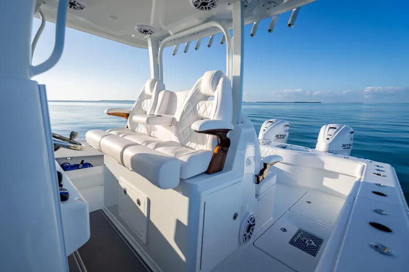 Slide: The Image of Luxurious 2026 Freeman 35 boat interior with plush seating and ocean view. - 24