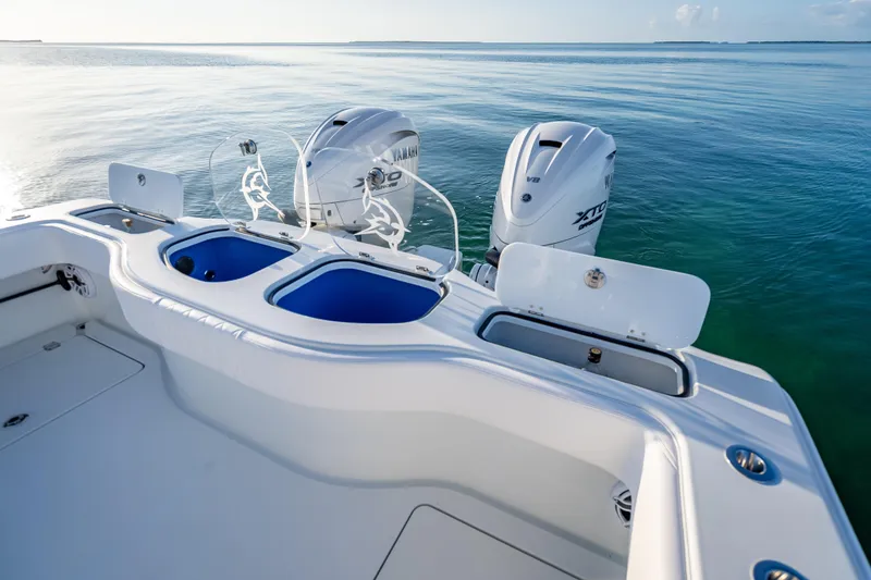 Slide: The Image of 2026 Freeman 35 boat with Yamaha engines on calm water. - 28