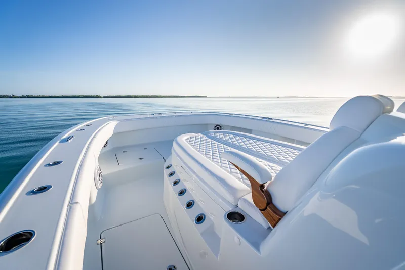 Slide: The Image of Luxurious 2026 Freeman 35 boat interior with sleek seating, on calm ocean waters. - 36