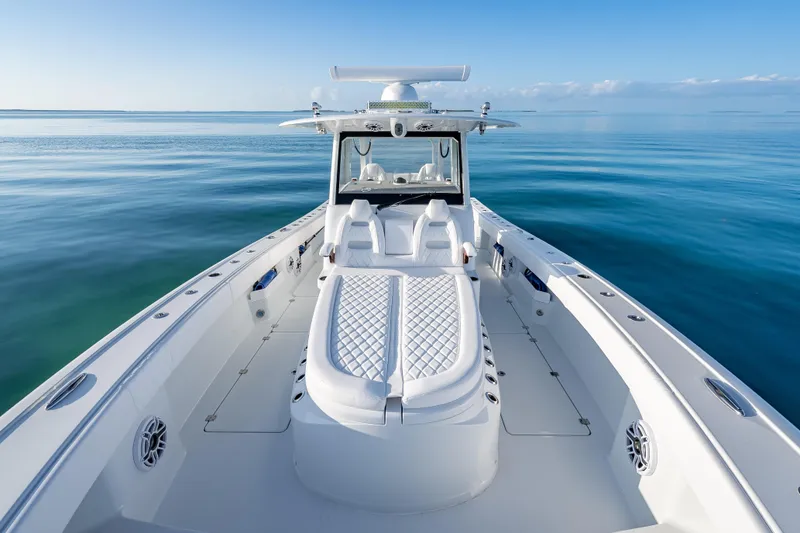 Slide: The Image of 2026 Freeman 35 boat on calm ocean, showcasing sleek design and luxury seating. - 38