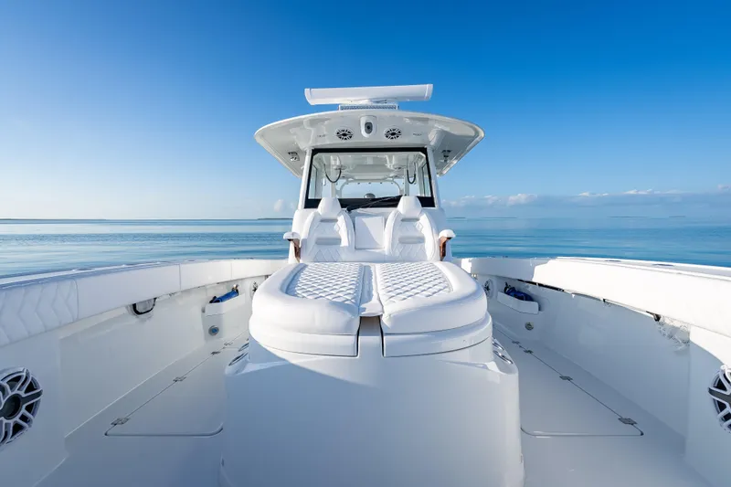 Slide: The Image of 2026 Freeman 35 boat on calm ocean, featuring sleek white design and spacious seating. - 39