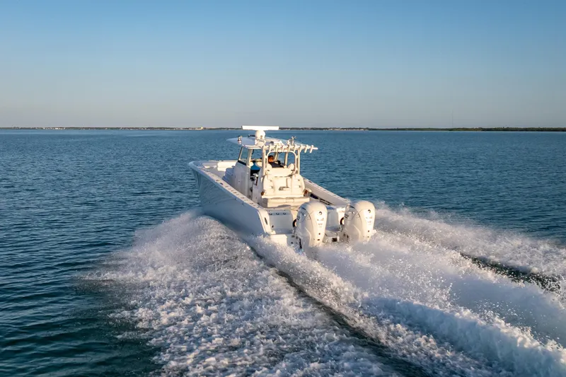 Slide: The Image of 2026 Freeman 35 boat cruising on open water, showcasing powerful engines and sleek design. - 4