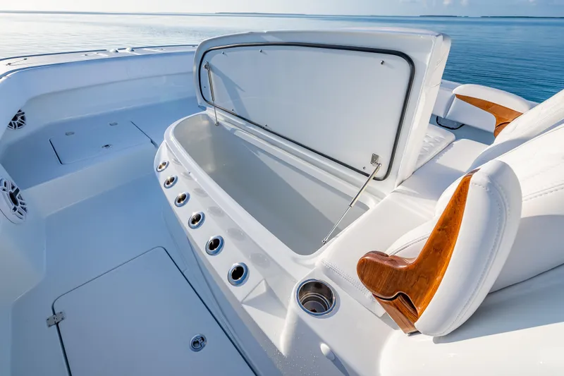 Slide: The Image of 2026 Freeman 35 boat interior with open storage compartment, sleek design, and wooden accents. - 41