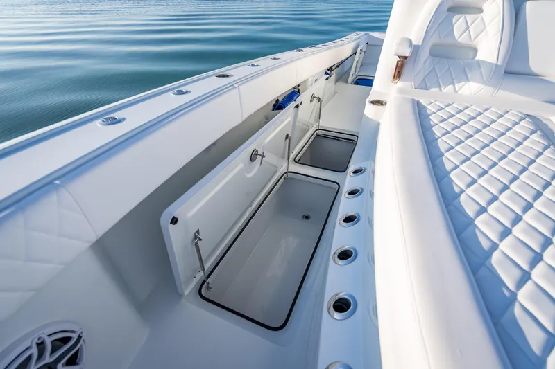 Slide: The Image of 2026 Freeman 35 boat interior with open storage compartments and quilted seating. - 43