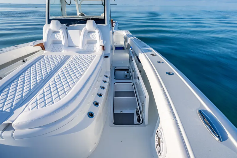 Slide: The Image of Luxurious 2026 Freeman 35 boat interior with white seating and open storage compartments. - 44