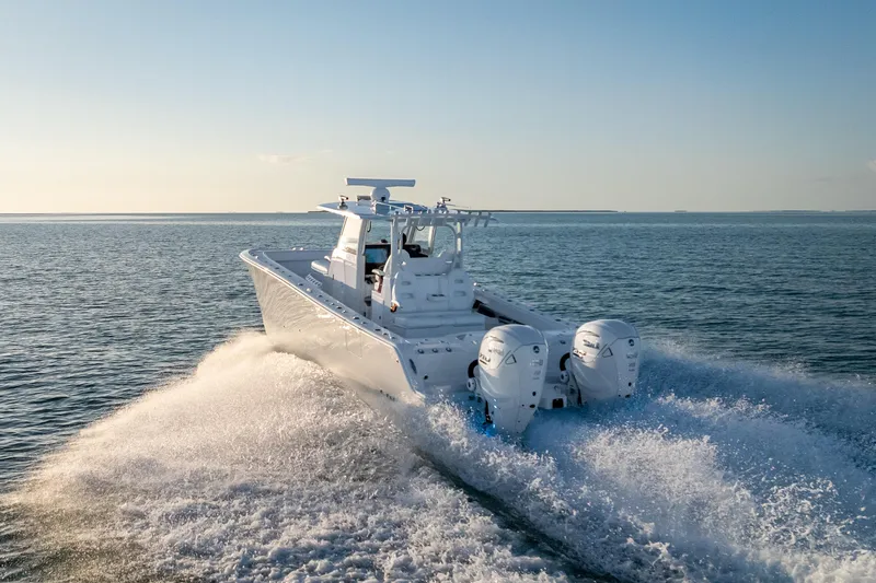 Slide: The Image of 2026 Freeman 35 boat cruising on open water at high speed. - 5