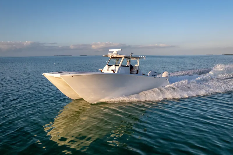 Slide: The Image of 2026 Freeman 35 boat cruising on calm ocean waters under a clear blue sky. - 6