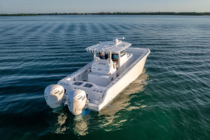 Slide: The Image of 2026 Freeman 35 boat with dual Yamaha engines cruising on calm water. - 8