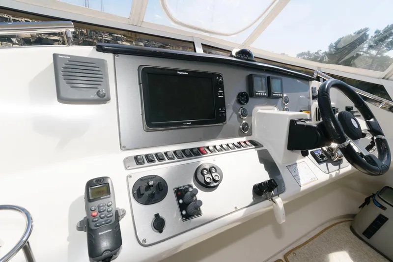 Slide: The Image of 2007 Carver 43 Motor Yacht helm with navigation equipment and controls. - 10